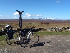 Sustrans marker showing maileage from Crask Inn to John O'Groats